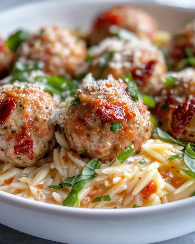 Homemade Creamy Sun-Dried Tomato Turkey Meatballs over Orzo recipe photo